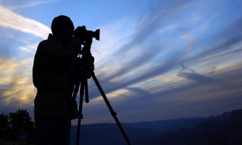Photographer on the rim of the Grand Canyon